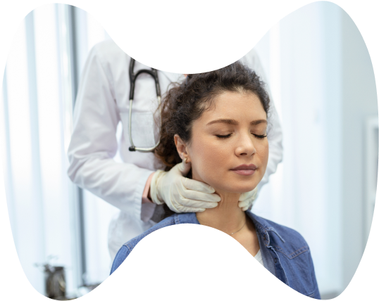 Close-up image of a doctor performing neck examination on a patient.