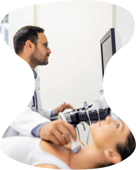A doctor undergoing an ultrasound for thyroid.