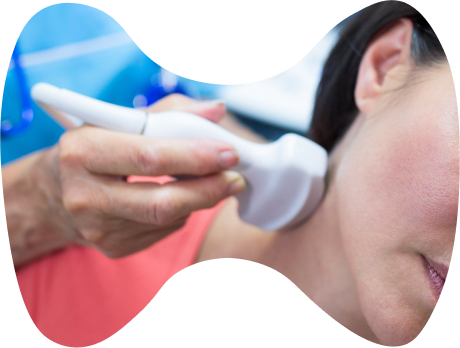 A patient undergoing an endocrine gland ultrasound by an expert.